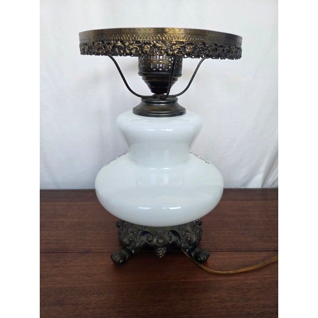 This beautifully preserved antique oil lamp reflects the elegance and craftsmanship of the late Victorian era, later...