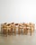 A rare and iconic set of eight danish mid century wooden dining chairs in pine with ergonomically sculptural backs and...