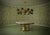 A distinctive circular chandelier in the shape of a Sputnik, with a brass frame and green Murano glass spheres. It...