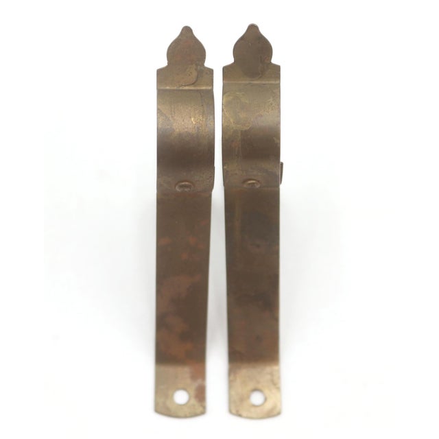 Vintage curtain rod brackets made of brass plated steel with a simple design. The original mounting screws are not...