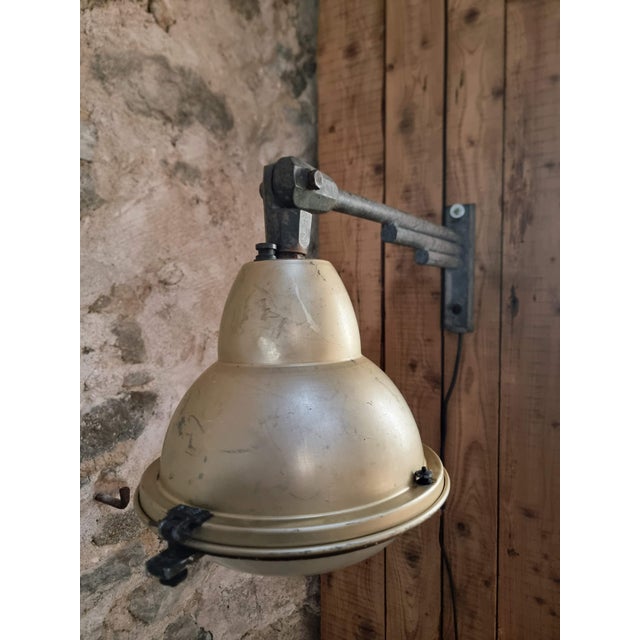 This vintage wall-mounted light, dating from the 1950s, is designed in the style of a traditional street lamp. Originally...