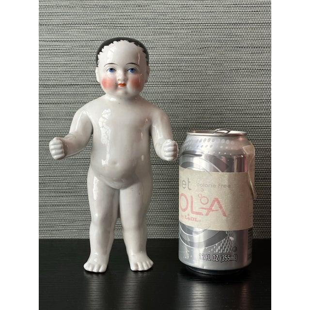Step back into the elegance of early 19th-century Europe with this rare German Biedermeier porcelain bathing doll, dating...