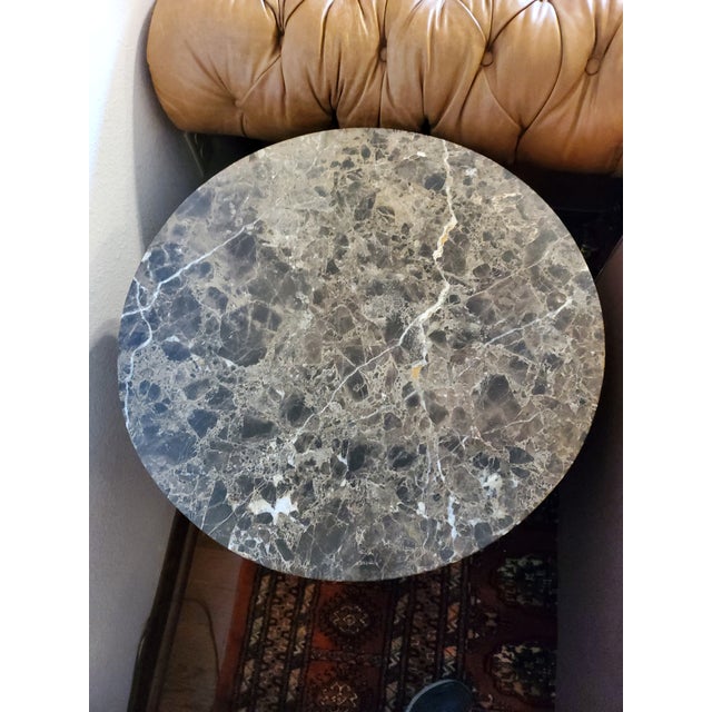 This end table has a beautiful marble top and elegant designs to give it depth and character. It has two doors and a lot...