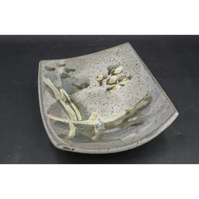 Mid Century studio shallow pottery bowl by well known California potter Joel Edwards (1923-2007). Rounded square shallow...