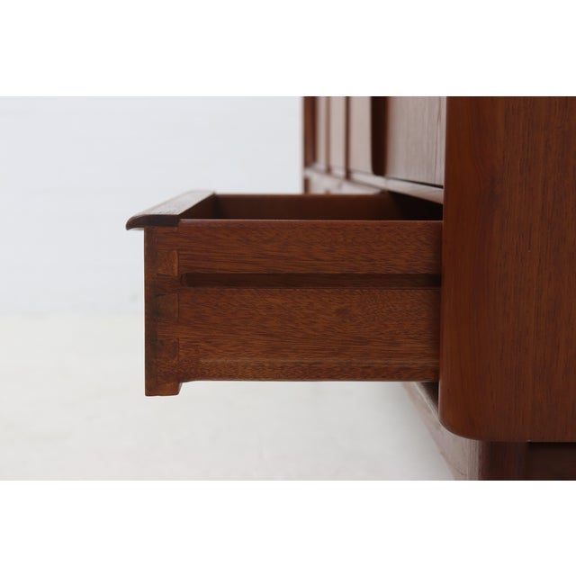 Impressive teak highboard designed by Svend Aage Madsen for K. Knudsen & Søn in the 1950's. This high quality highboard...