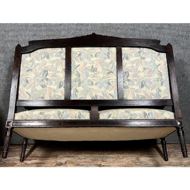 Louis XVI style salon suite in rosewood and gilt, circa 1850 Three pieces comprising a large banquette (106 x 151 x 75 cm)...