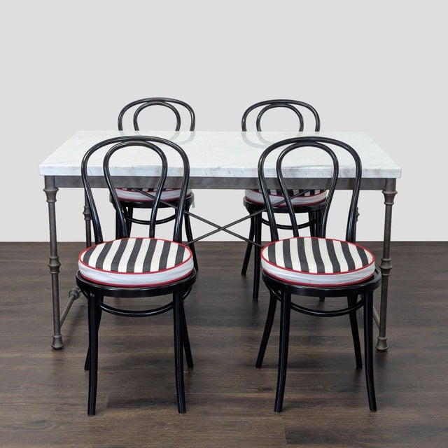 This Crate and Barrel dining set includes a sturdy rectangular table with a sleek white marble top and strong metal legs....