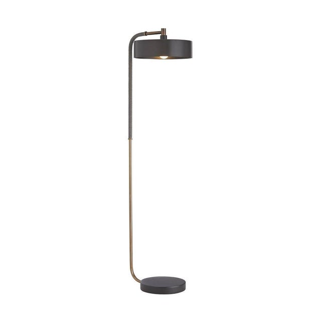 This contemporary floor lamp possesses a modern sensibility defined by a sleek style and masterly materials. A heritage...