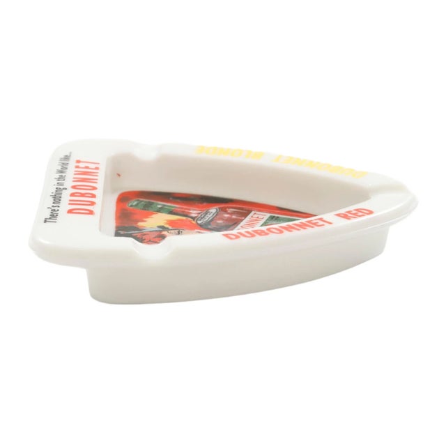 An opaline glass ashtray made by French company Opalex. Branded Dubonnet with Dubonnet Red and Dubonnet Blonde on a wide...