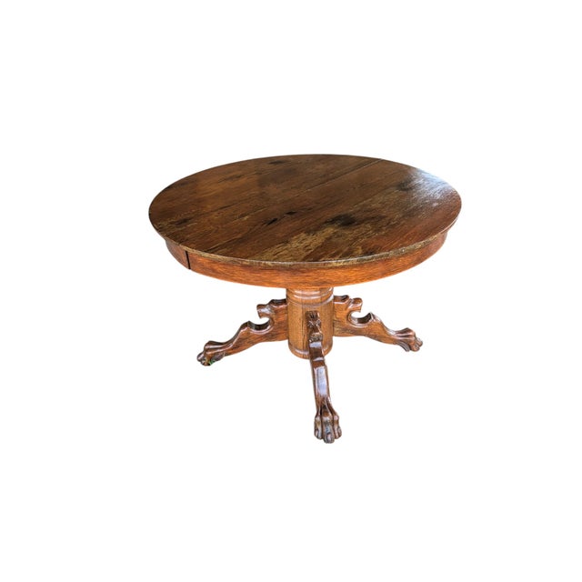 Commanding architectural presence meets timeless craftsmanship in this exceptional antique solid oak dining table....