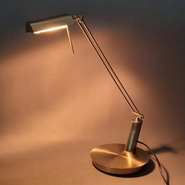 A rare and charming table lamp, produced by the Italian company Fabas Luce. This model, inspired by classic banker's...