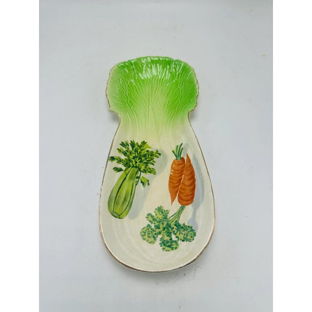 This is a vintage ceramic dish designed in the shape of a leafy green vegetable (it resembles a cabbage leaf or romaine...