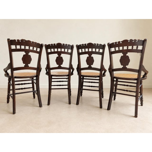 A matched set of four late-19th-century Victorian Eastlake armchairs, American, circa 1880–1900. Each chair features a...
