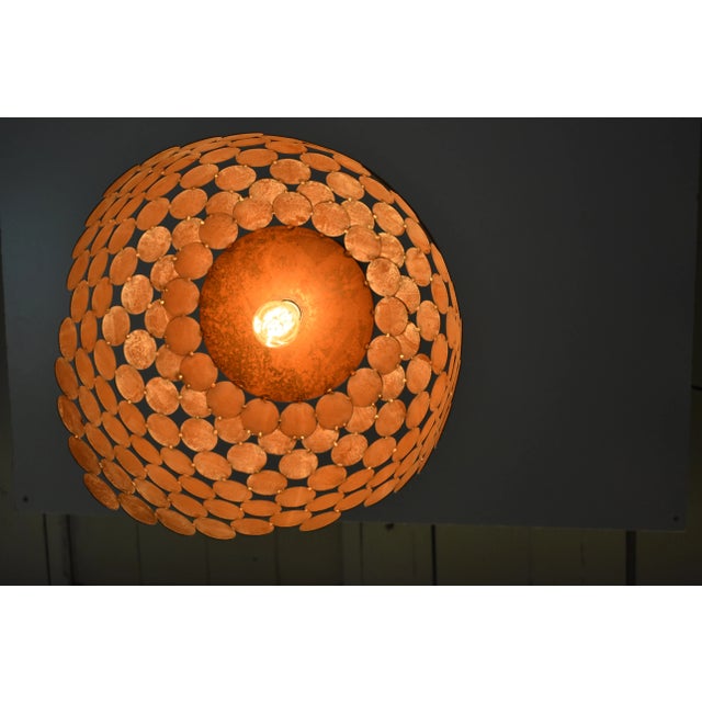 This design uses 2" DIA discs regularly agglomerated edge to edge and held in place with bronze. Hand made by designer...