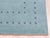 A 10' x 14' hand-knotted wool rug with a plain aqua Gabbeh-style field with a simple dotted border in a deeper blue. Newly...