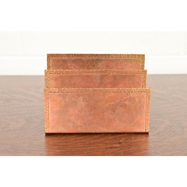 A gorgeous Arts & Crafts period hand hammered copper letter rack By Roycroft (signed with impressed orb and cross mark)...