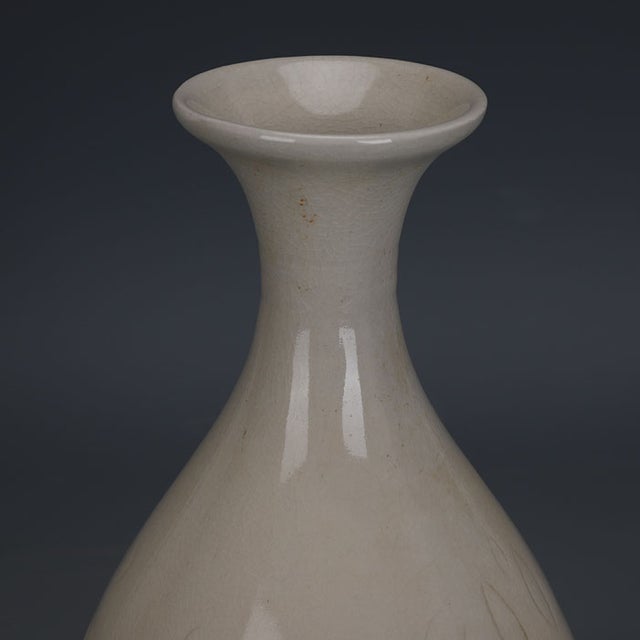 Add a touch of serene elegance to your home with this vintage-style Chinese porcelain vase. This beautifully proportioned...