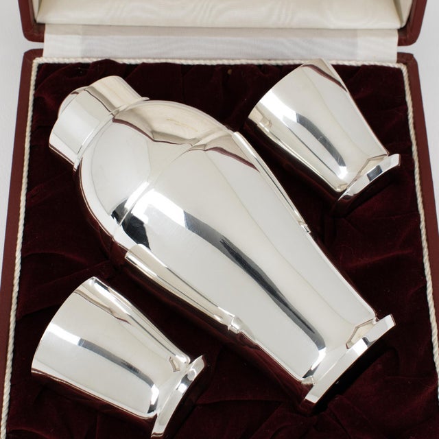 Silversmith Saint Medard, Paris, crafted this exquisite Art Deco barware ensemble circa 1940, still in its original gift...