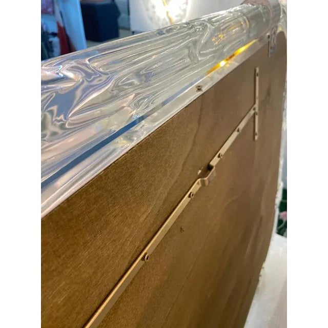 Scenographic wall mirror in murano glass full of silver brass and transaprent frame solid detail in silver brass. A luxury...