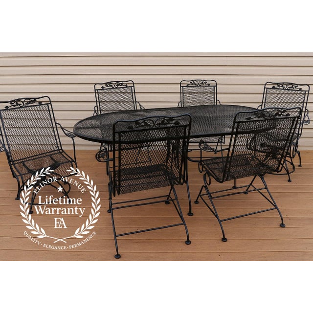 Featuring the Meadow Craft Acorn and Oak Leaf Wrought Iron Six-Chair Family Patio Set—a stunning combination of elegance,...