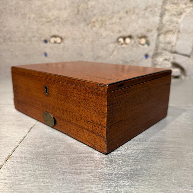 For your consideration, a 19th-century English artist's watercolour box, likely made of mahogany, featuring the...