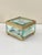 Superb rectangular jewelry box in clear glass with a gilt brass mount, resting on four small ball feet. Hinged glass lid...