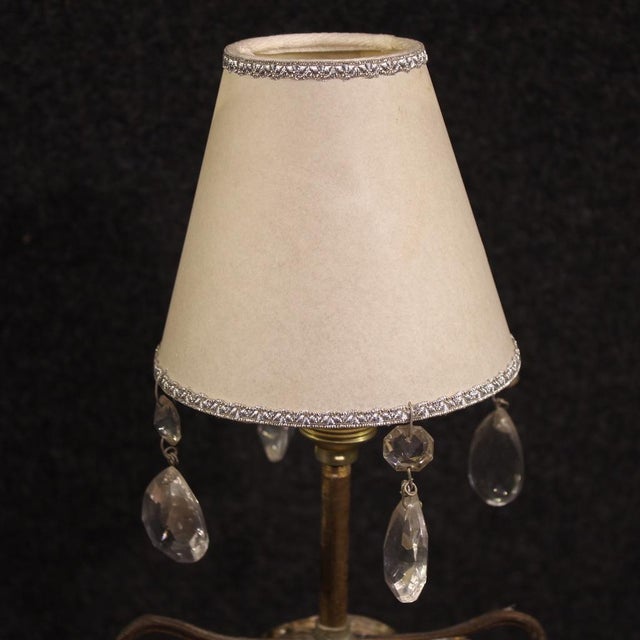 Mid-20th-century Italian table lamp. A Brutalist-style wrought metal object stamped under the base with Bragalini Bologna...