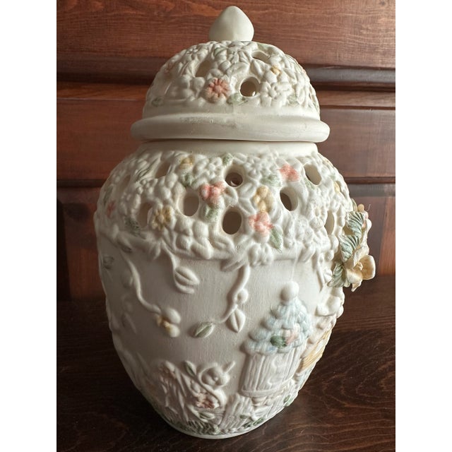Lidded ceramic ginger jar shaped potpourri holder. It has cutouts to allow the aroma of potpourri to diffuse. Ivory...