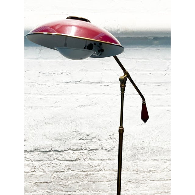 Attributed Gerald Thurston articulating saucer brass and enamel floor lamp for Lightolier. Brass and maroon enamel. Angle...