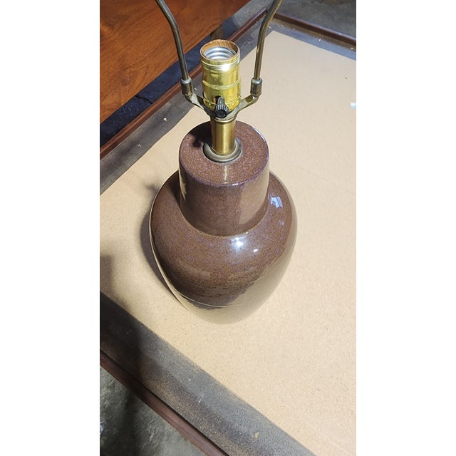 Large-scale ceramic table lamp designed by Lee Rosen for Design Technics, featuring a tall bottle-form body with a tapered...
