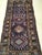 A vintage Kurdish area rug from the first quarter of the 20th century featuring a striking five-medallion design — a...