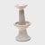 Elegant in its simplicity, this late 19th-century Chinese candle stand is decorated only by an allover pale glaze with...
