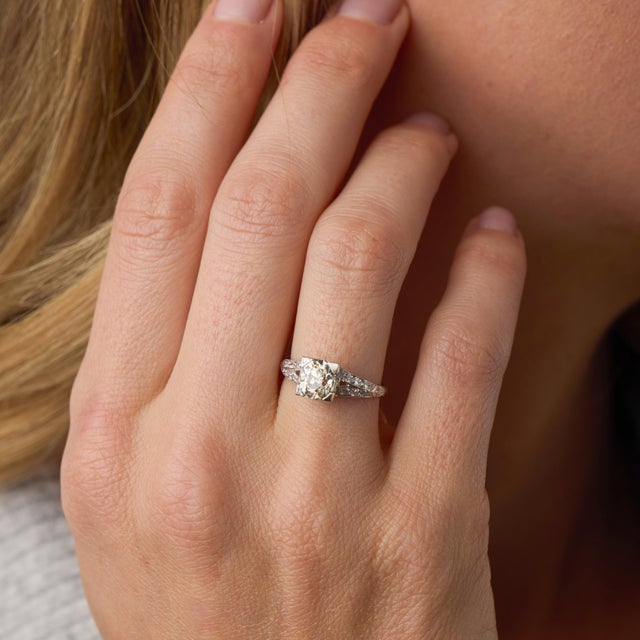 This elegant Art Deco engagement ring centers on a 1.35 carat old mine cut diamond, certified by GIA #1232903921,...