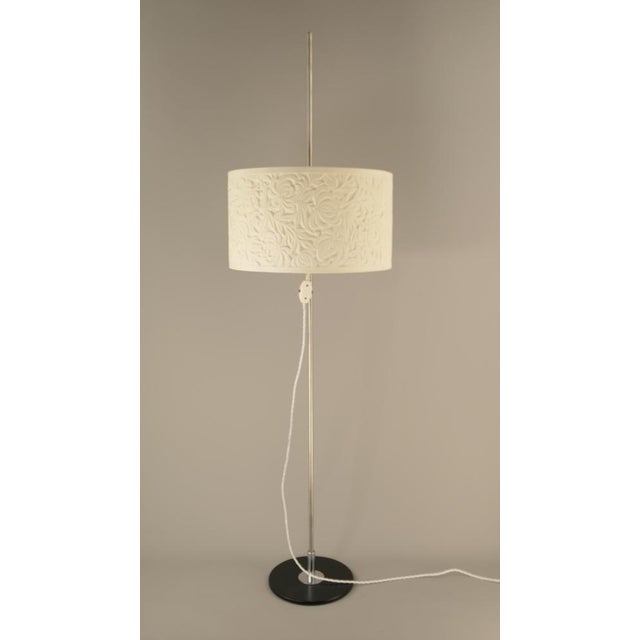 Italian floor lamp with extravagant plastic lampshade. The shade can be adjusted on the stand between 80 and 150 cm...