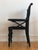 Victorian black-painted concert chair with an adjustable leather seat on a hinged mechanism, crafted around 1900. The...
