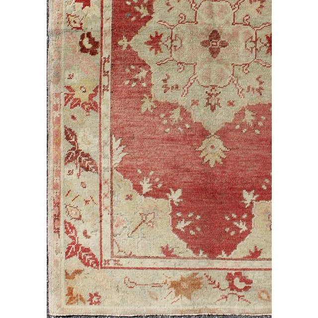 Measures: 3'5 x 5'6 Red Field Vintage Turkish Oushak Rug with Geometric Medallion And Floral Motifs. Keivan Woven Arts /...