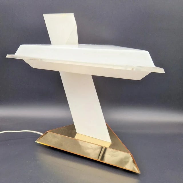 Italian Table Lamp in Opal Acrylic Glass by Nina Ricci, 1970s, in Very Good conditions. Designed 1970 to 1979 I have...