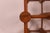 A Danish mid-century modern wine rack Made in Denmark Stamped emblem Produced by Nissen Circa 1960 Teakwood material