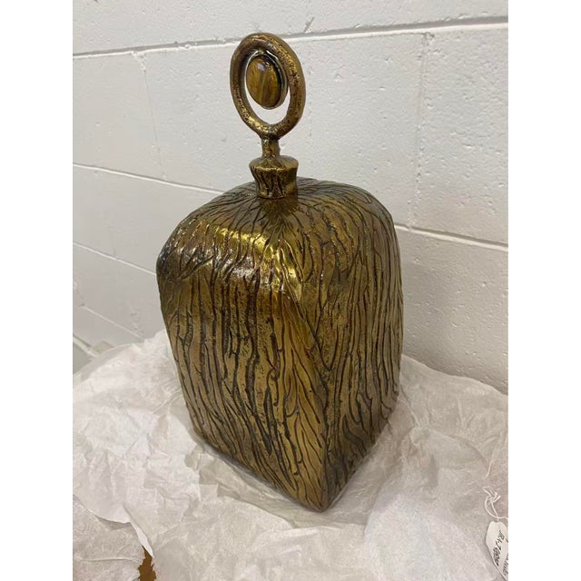 The Bengali Vase is a chic, stylish accent piece that showcases a stunning variety of textures. Craftedfrom metal and...