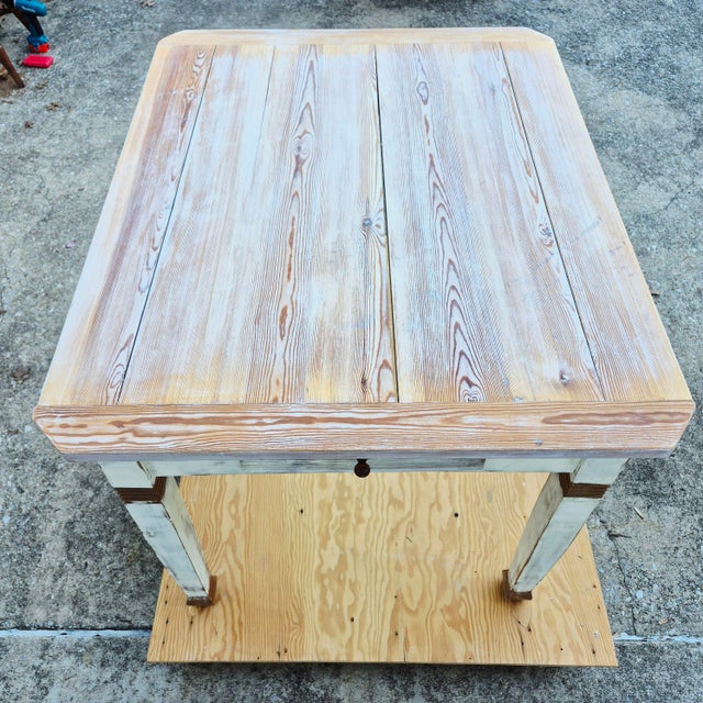 This is a charming old pine table with a newer Gustavian Swedish farmhouse style off-white milk painted finish. The table...