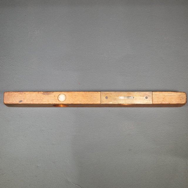 ABOUT A vintage level with two bubbles, large brass label and brass accents. CREATOR Goodell-Pratt Company, Mass. DATE OF...