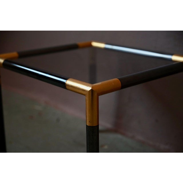 Classy and understated, this small side table dates from the 1970s and is inspired by Italian modernist design, an era...
