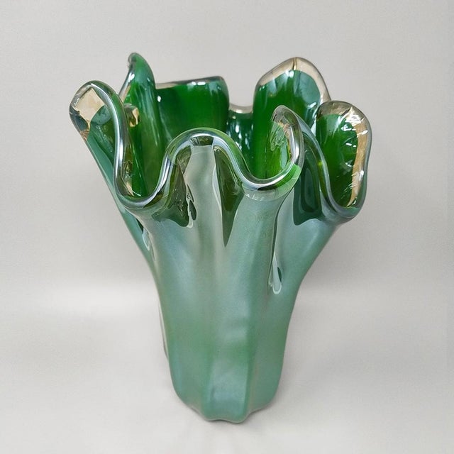 1970s Exquisite green Murano Glass "Fazzoletto" vase by Dogi handcrafted in Murano, Italy. This piece features the iconic...