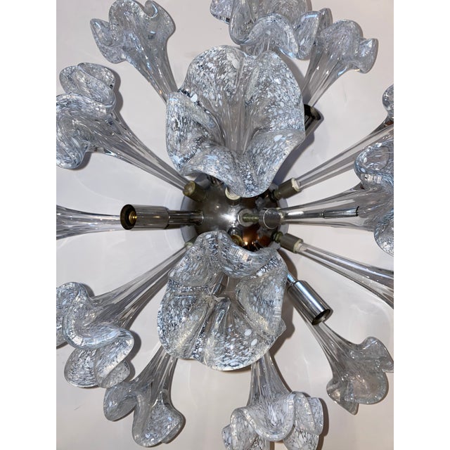 A mid-century six light flush mounted chromed metal sputnik chandelier. It is comprised of 15 hand blown Venini style...