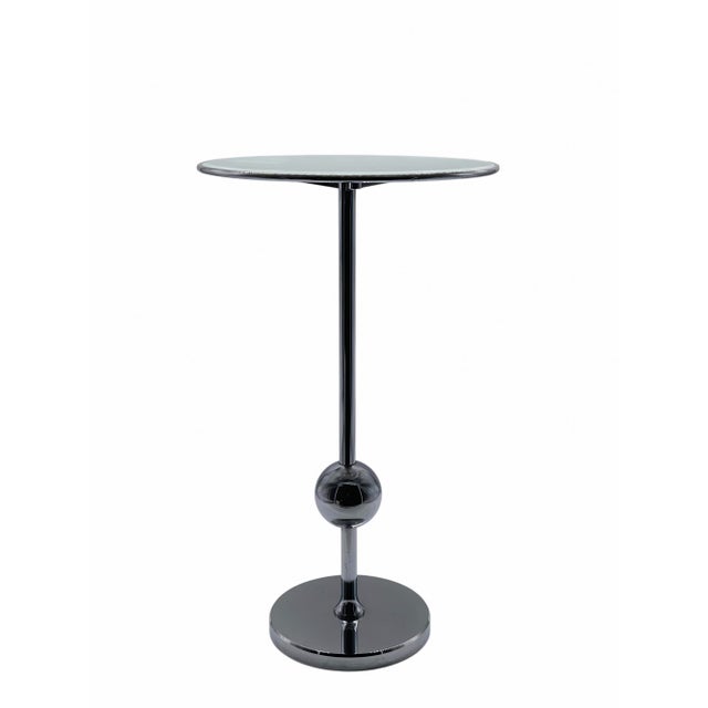 A rare and stunning t1 coffee table designed by osvaldo borsani for tecno. the table stands out for its silhouette,...
