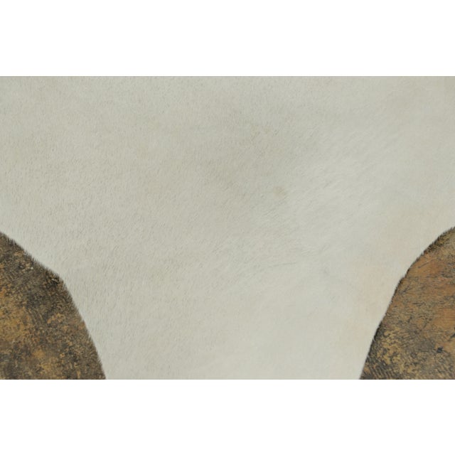 This 7x8 contemporary cowhide rug is an exciting new addition to Rug & Kilim’s Modern collection—a naturally shaped animal...