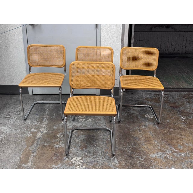 Design Plus Gallery presents a Set of Four Cesca Dining Side Chairs from Marcel Breuer. Take these chairs home for an easy...