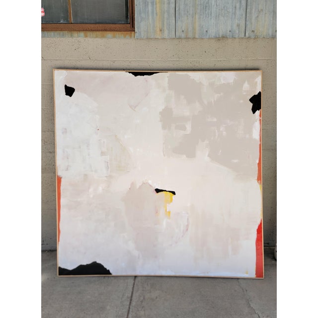 Large-Scale modern abstract painting on canvas. White primary color with accents of red, black and yellow. Framed in...