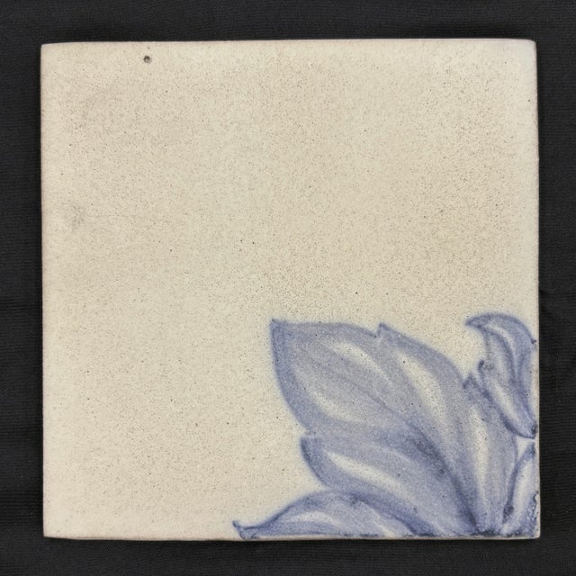 Decorative handmade ceramic tile panel featuring a hand painted blue watteau fruit urn motif on an antique white matte...