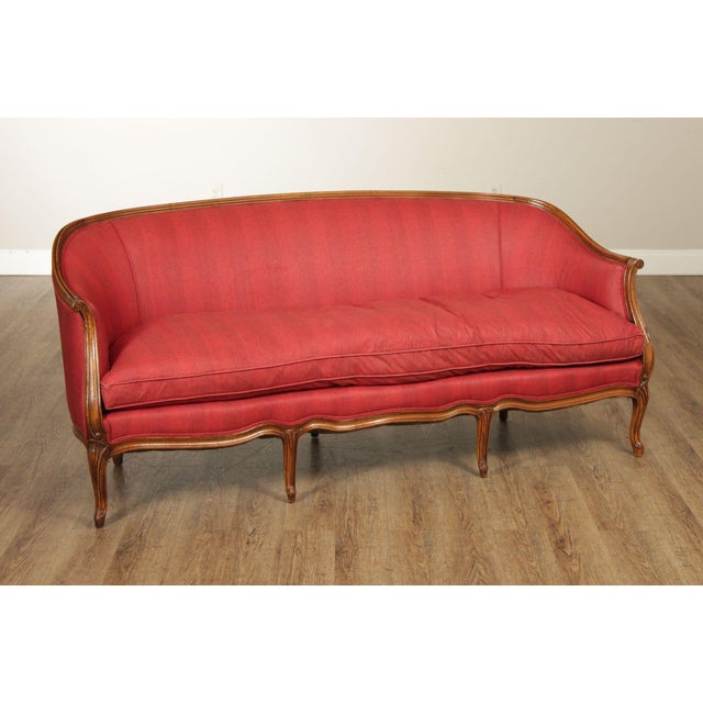 High Quality French Louis XV Style Sofa Featuring Carved Walnut Frame With Serpentine Front And Cabriole Legs. Upholstered...